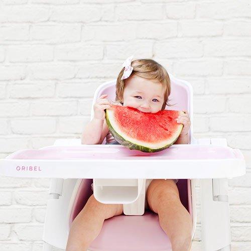 baby sitting on baby high chair 